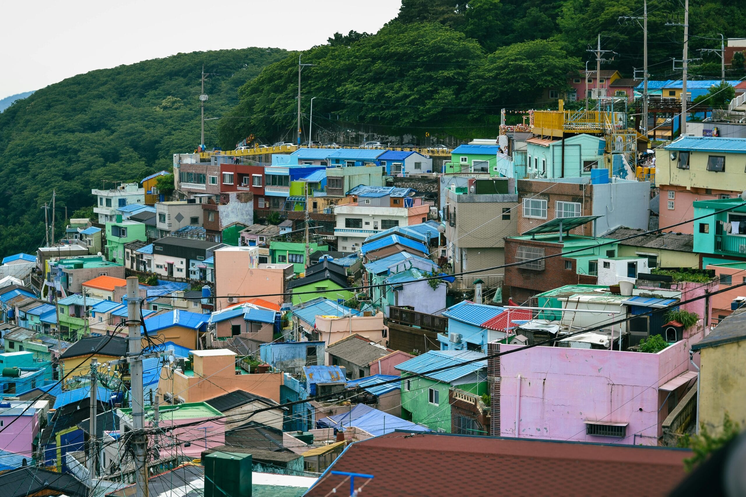 A vibrant view of the colorful houses in Gamcheon Culture Village, Busan, showcasing traditional and modern Korean architecture.